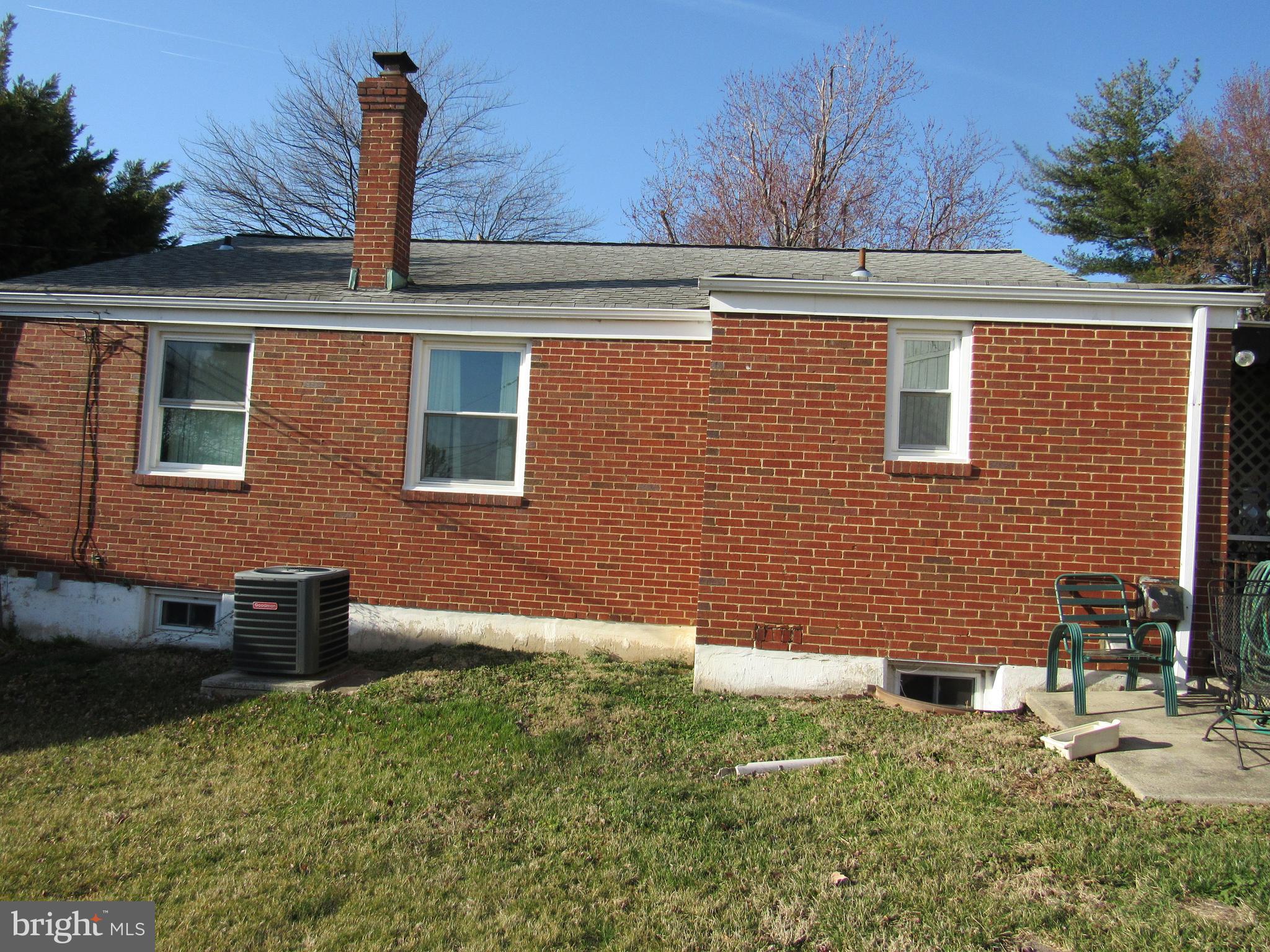 6301 Fieldvale Road Baltimore, MD 21237 - Photo 19 of 28 a view of a brick house with a yard