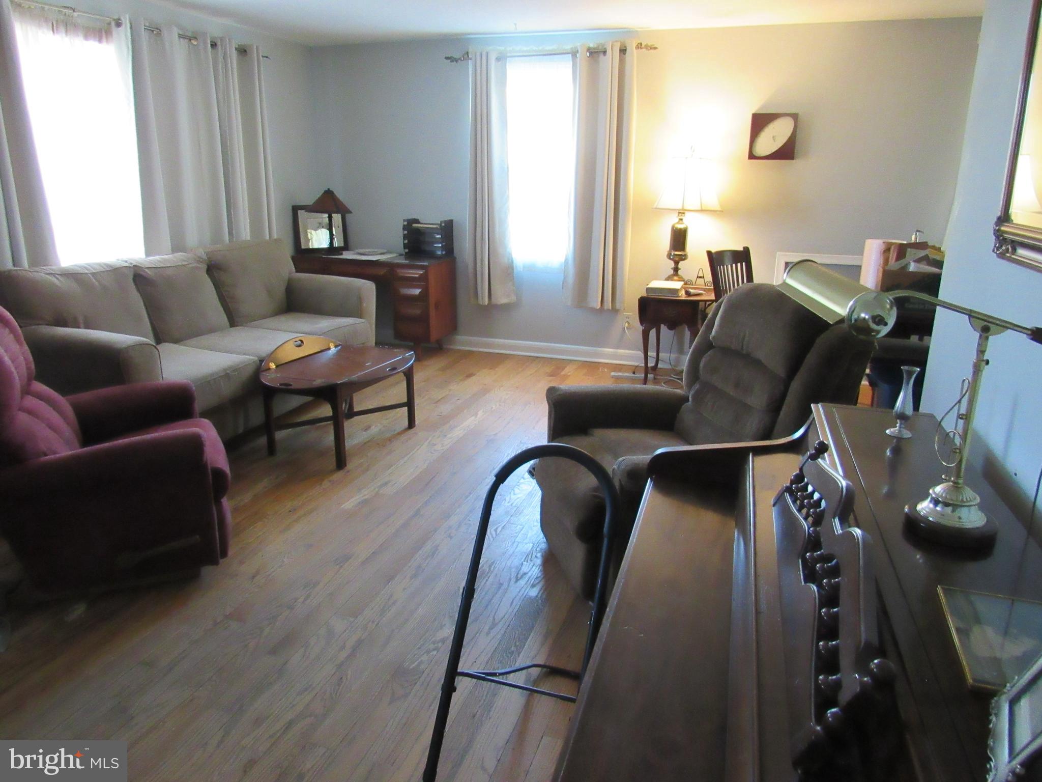 6301 Fieldvale Road Baltimore, MD 21237 - Photo 2 of 28 a living room with furniture and wooden floor