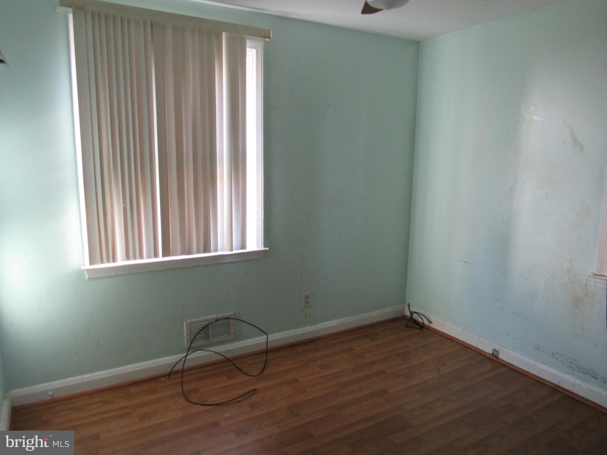 6301 Fieldvale Road Baltimore, MD 21237 - Photo 23 of 28 a room with a window and wooden floor