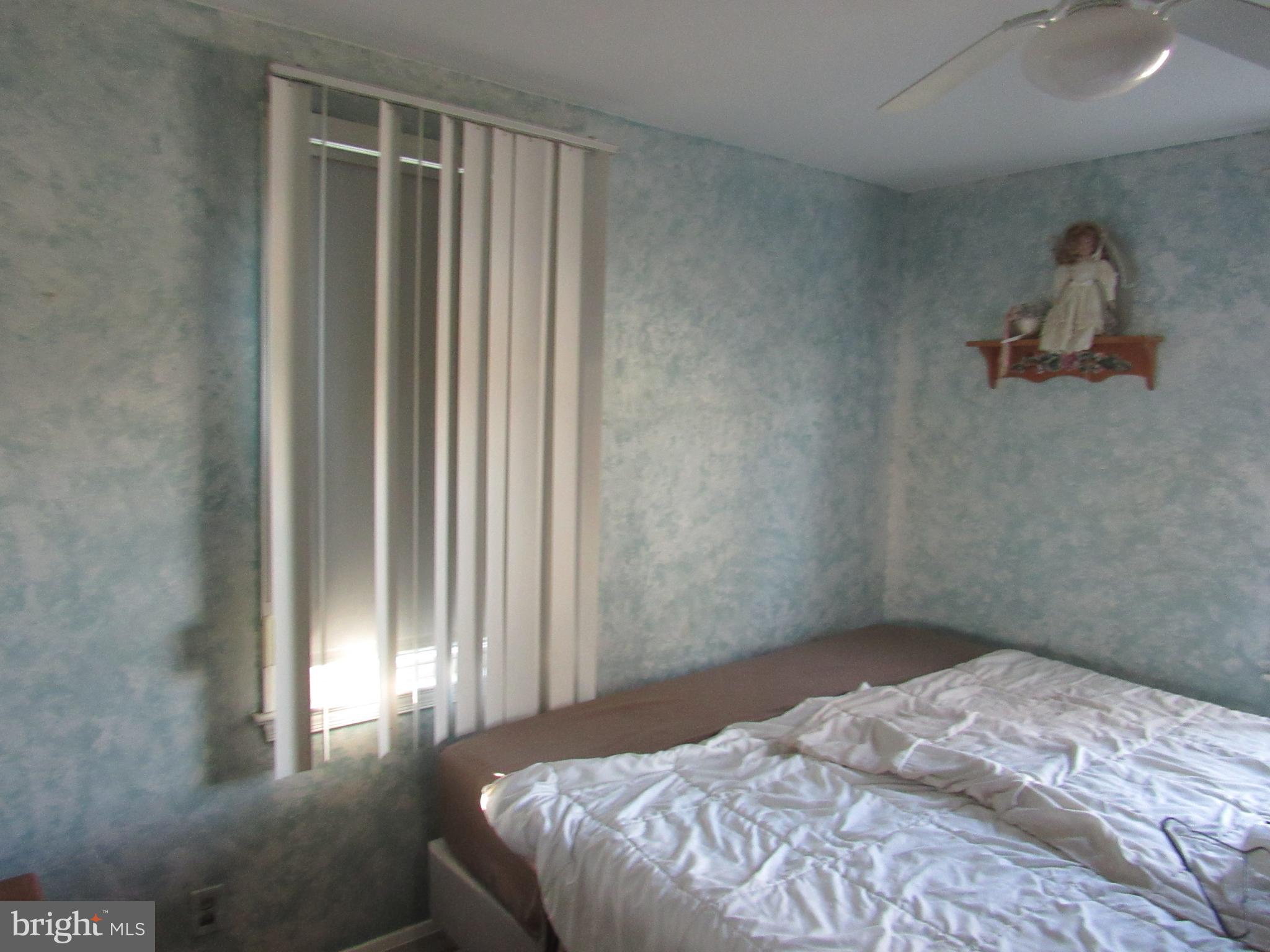 6301 Fieldvale Road Baltimore, MD 21237 - Photo 24 of 28 a bedroom with a bed and a window