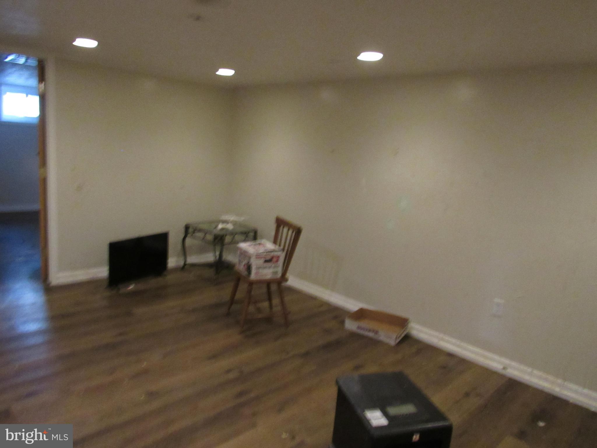 6301 Fieldvale Road Baltimore, MD 21237 - Photo 26 of 28 a view of a workspace with furniture and wooden floor