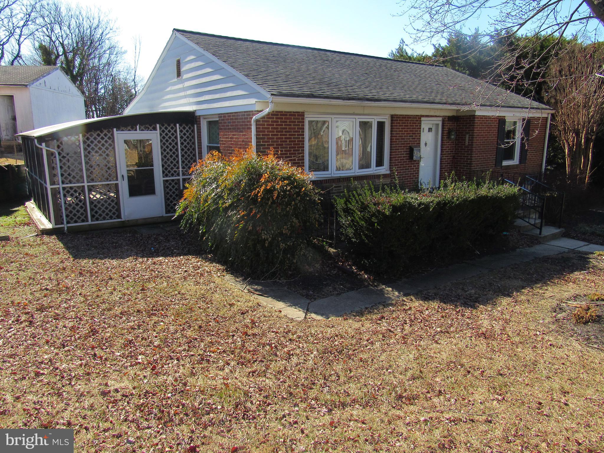 6301 Fieldvale Road Baltimore, MD 21237 - Photo 3 of 28 a front view of house with yard and trees around