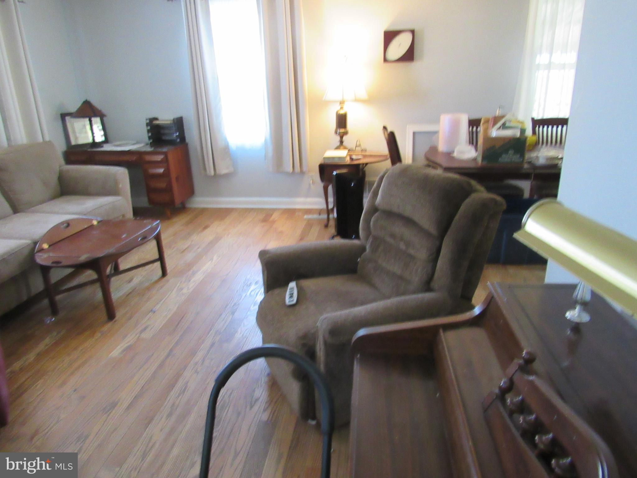 6301 Fieldvale Road Baltimore, MD 21237 - Photo 4 of 28 a living room with furniture and a wooden floor