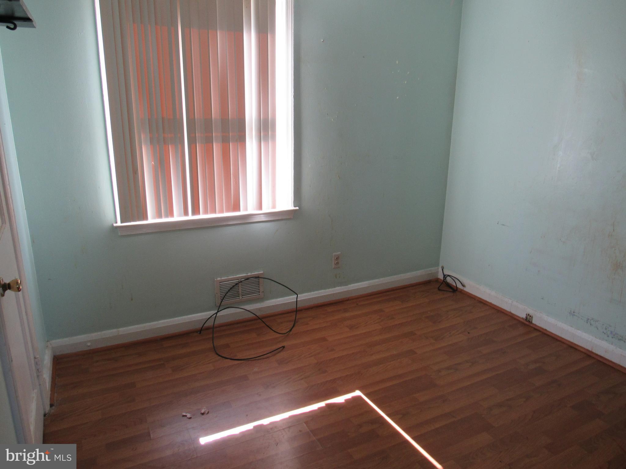 6301 Fieldvale Road Baltimore, MD 21237 - Photo 8 of 28 a room with wooden floor and windows