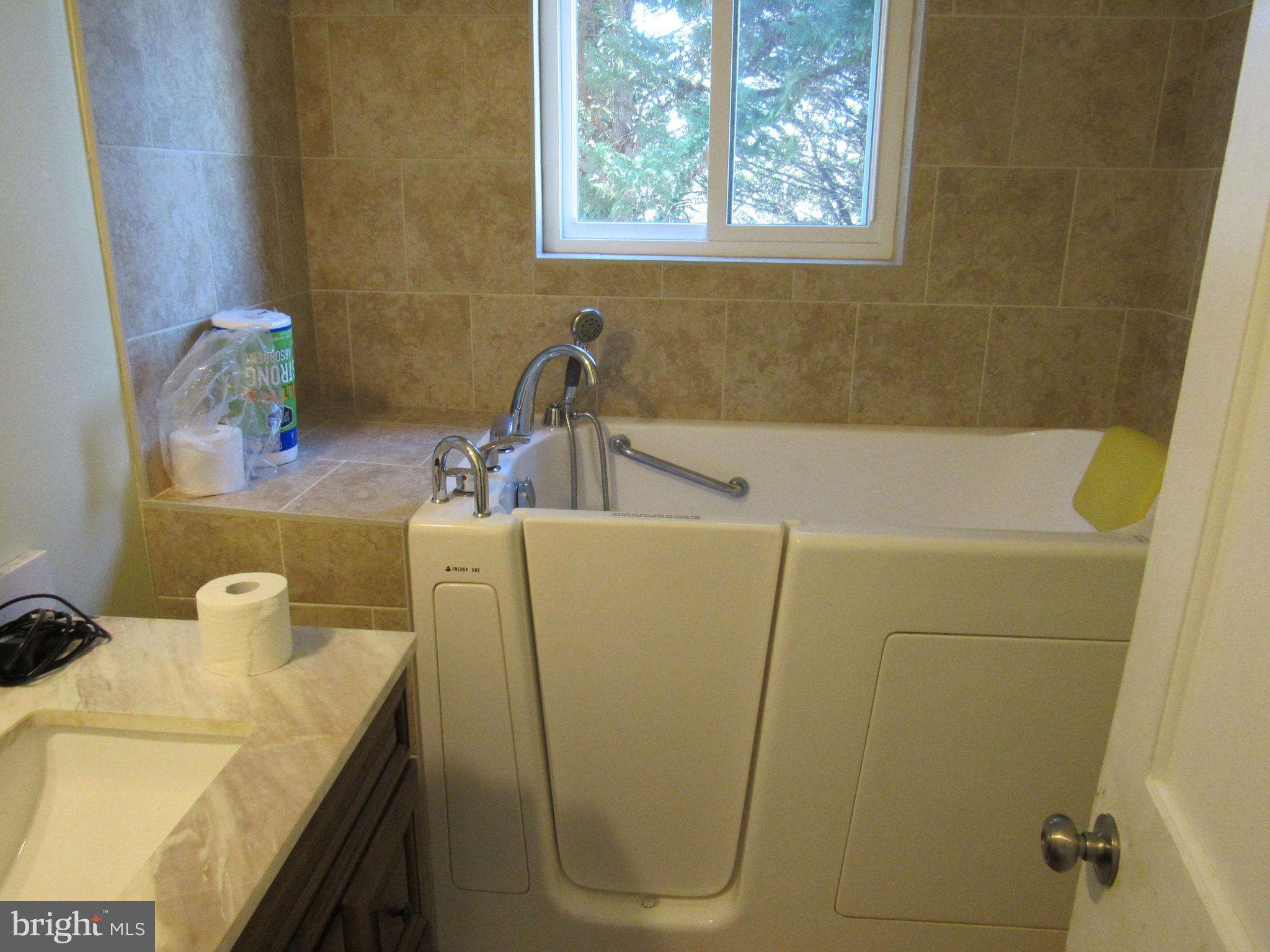 6301 Fieldvale Road Baltimore, MD 21237 - Photo 9 of 28 a bathroom with a sink and a tub