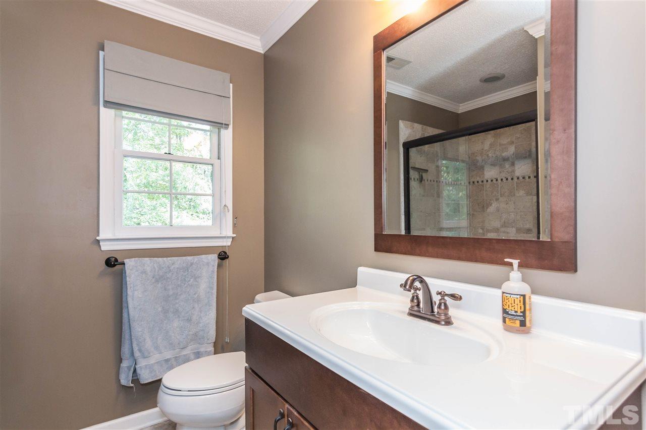 4546 Malvern Road Durham, NC 27707 - Photo 13 of 20 The master bath is appointed with beautiful tile floors and shower surround. And not some dinky shower but a full size shower to wash those cares away.