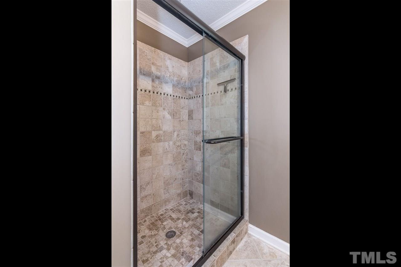 4546 Malvern Road Durham, NC 27707 - Photo 14 of 20 I can hear the raining down of the water from the shower in this updated bathroom.