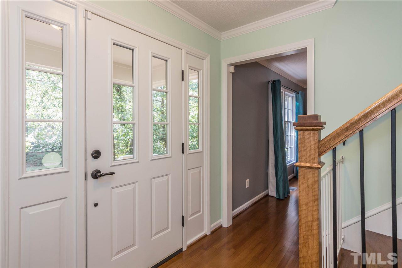 4546 Malvern Road Durham, NC 27707 - Photo 3 of 20 The front door and side panels allow for light to stream through for a comforting feel.