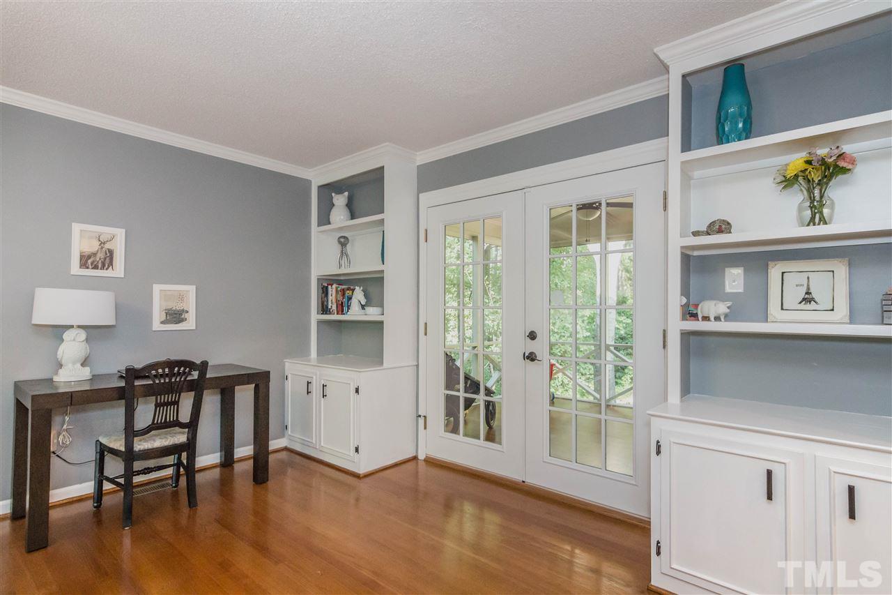 4546 Malvern Road Durham, NC 27707 - Photo 6 of 20 Not one but two built-ins which flank the French doors. There is even enough space in the room to house a desk. This living room is truly a space to live in.