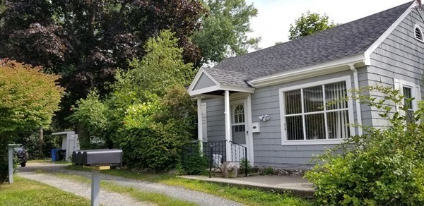 11-13 Colrain Street Greenfield, MA 01301 - Photo 3 of 10 a front view of a house with a yard