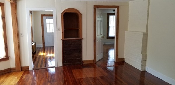 11-13 Colrain Street Greenfield, MA 01301 - Photo 7 of 10 wooden floor in an empty room with a window