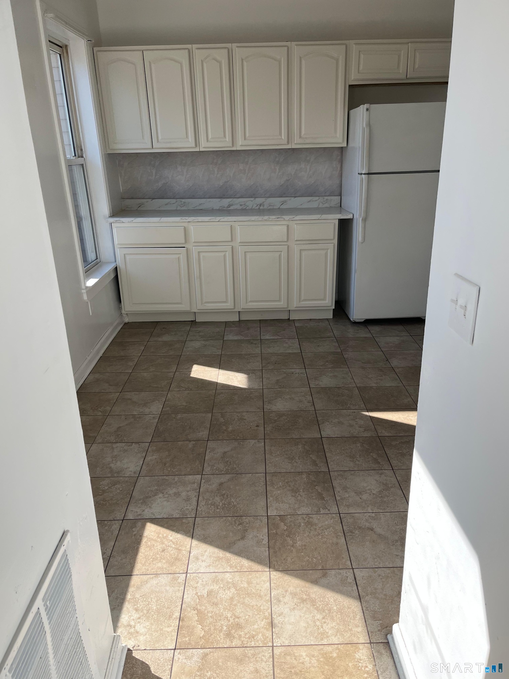 40 Jane Street, Unit 1 Bridgeport, CT 06608 - Photo 2 of 5 a kitchen with a sink