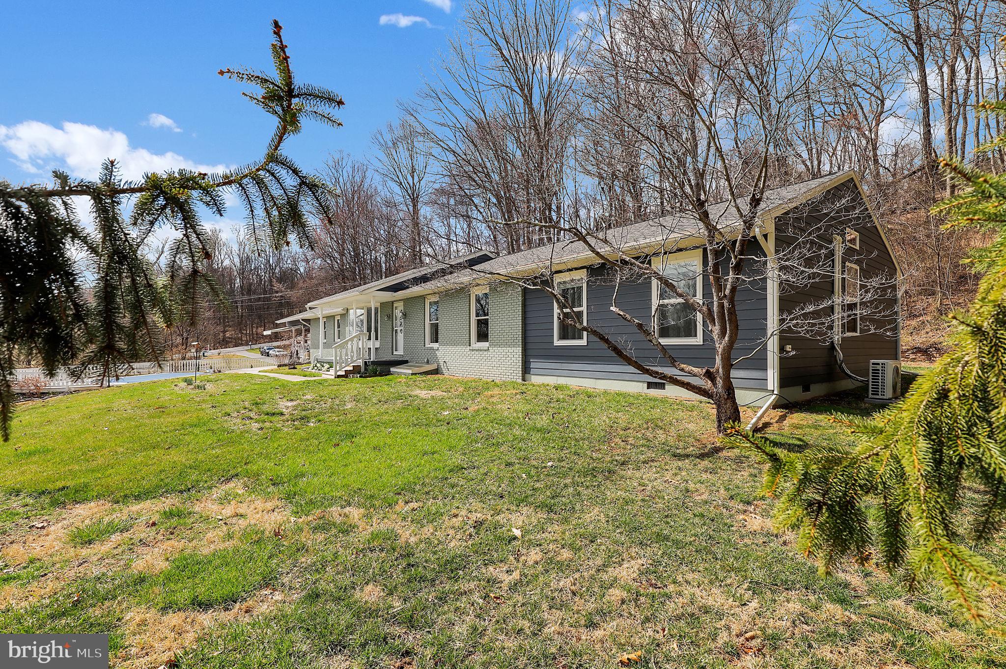 14336 Shirley Bohn Road Mount Airy, MD 21771 - Photo 43 of 56 a view of a house with a backyard