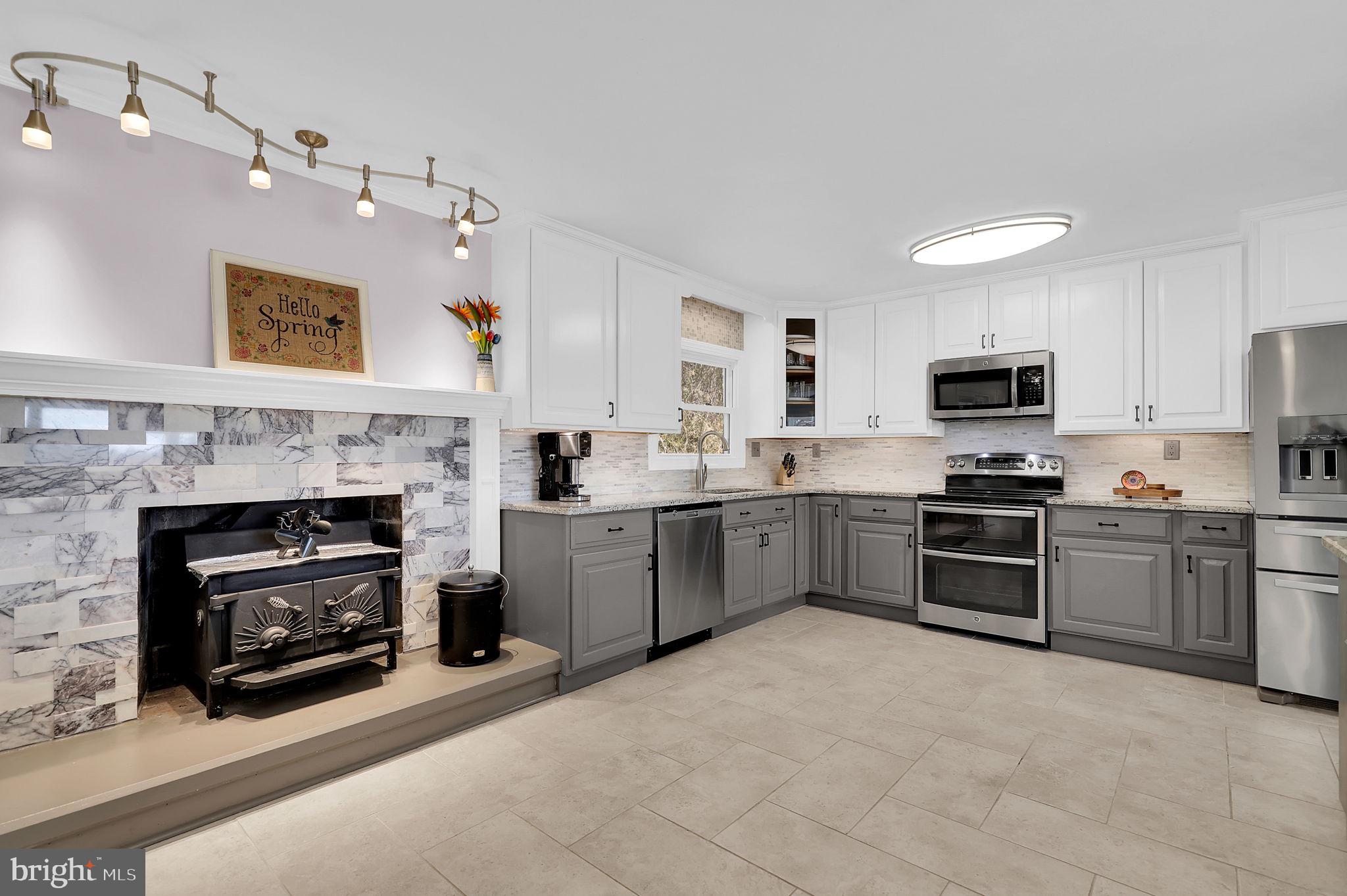 14336 Shirley Bohn Road Mount Airy, MD 21771 - Photo 6 of 56 a kitchen with a stove sink and refrigerator