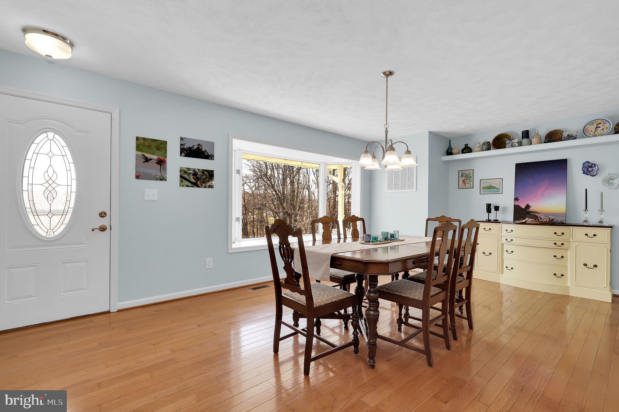 14336 Shirley Bohn Road Mount Airy, MD 21771 - Photo 9 of 56 a dining room with furniture window and wooden floor