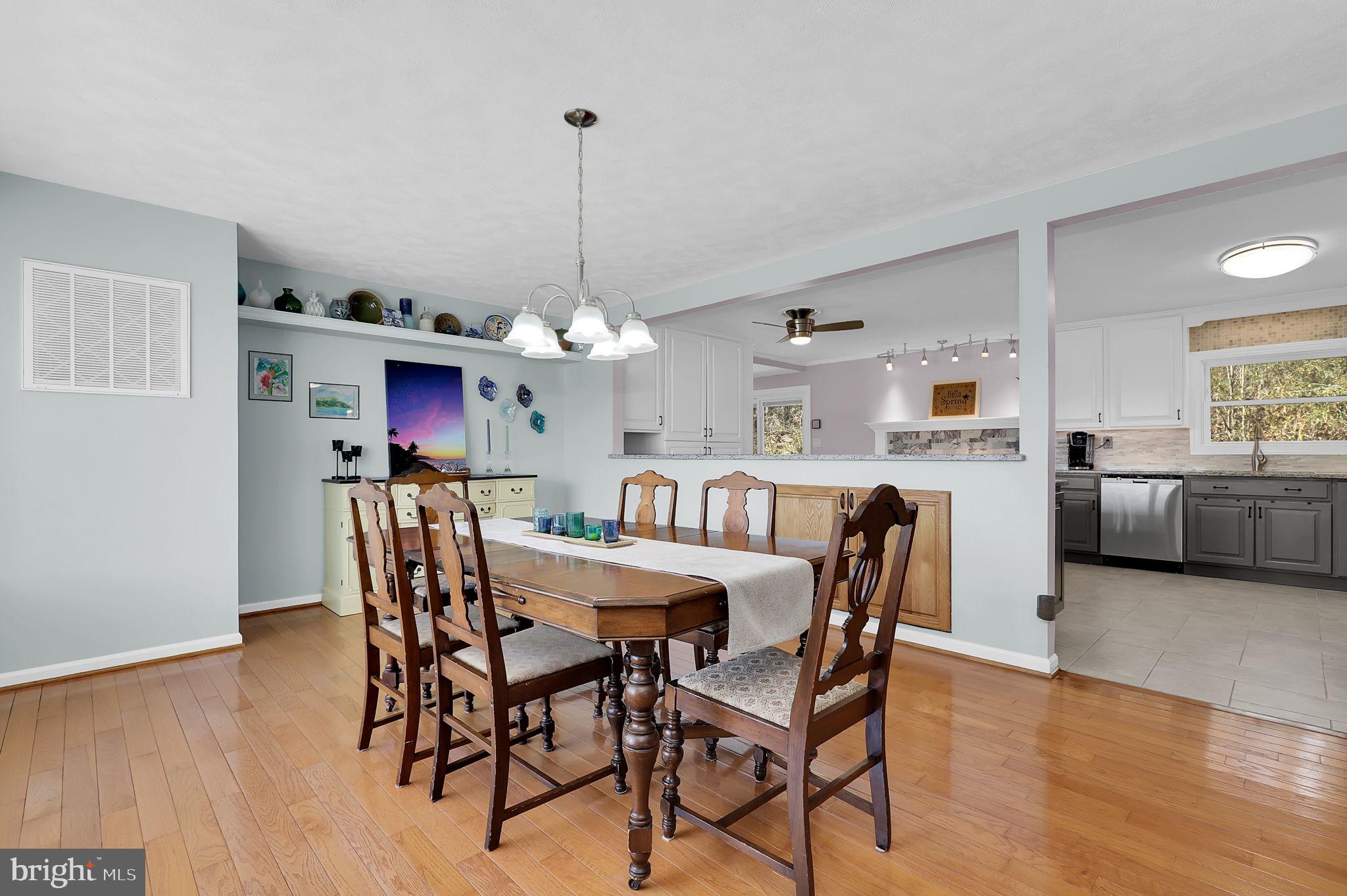 14336 Shirley Bohn Road Mount Airy, MD 21771 - Photo 10 of 56 a view of a dining room with furniture window and wooden floor