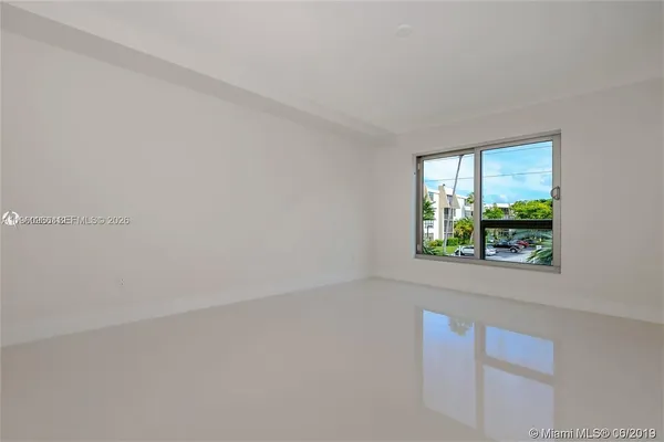 a view of an empty room with window