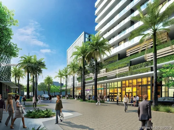 a row of palm trees in front of building