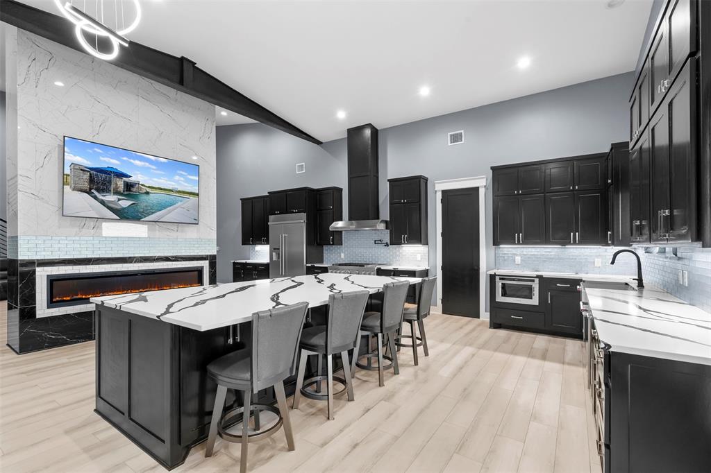 9700 Nix Road Tolar, TX 76476 - Photo 4 of 39 a large kitchen with a table and chairs
