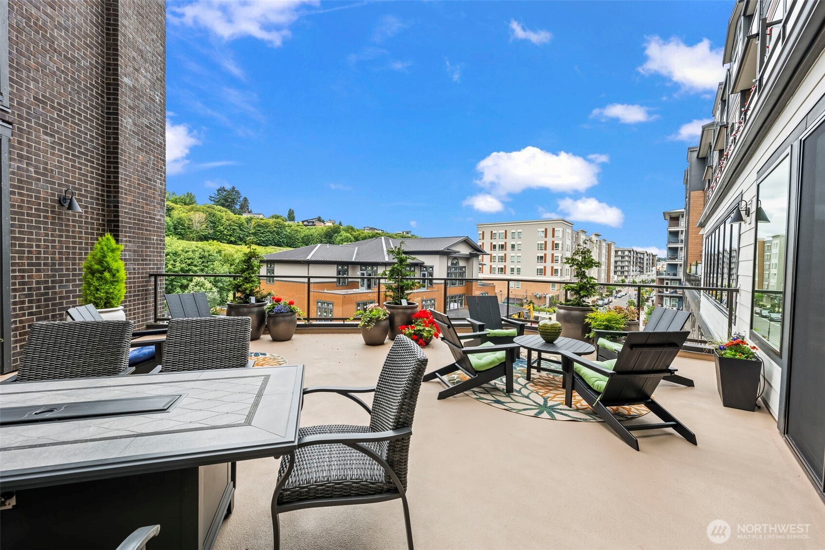 4907 Main Street, Unit 214 Tacoma, WA 98407 - Photo 26 of 34 a view of a chairs and table in a patio