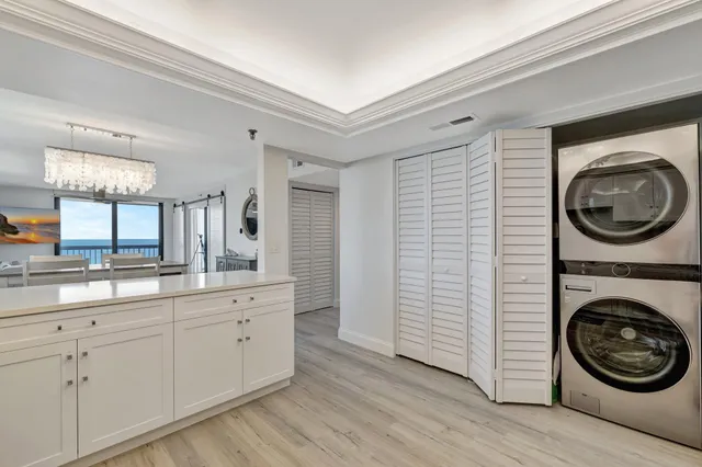 a view of a hallway with washer and dryer