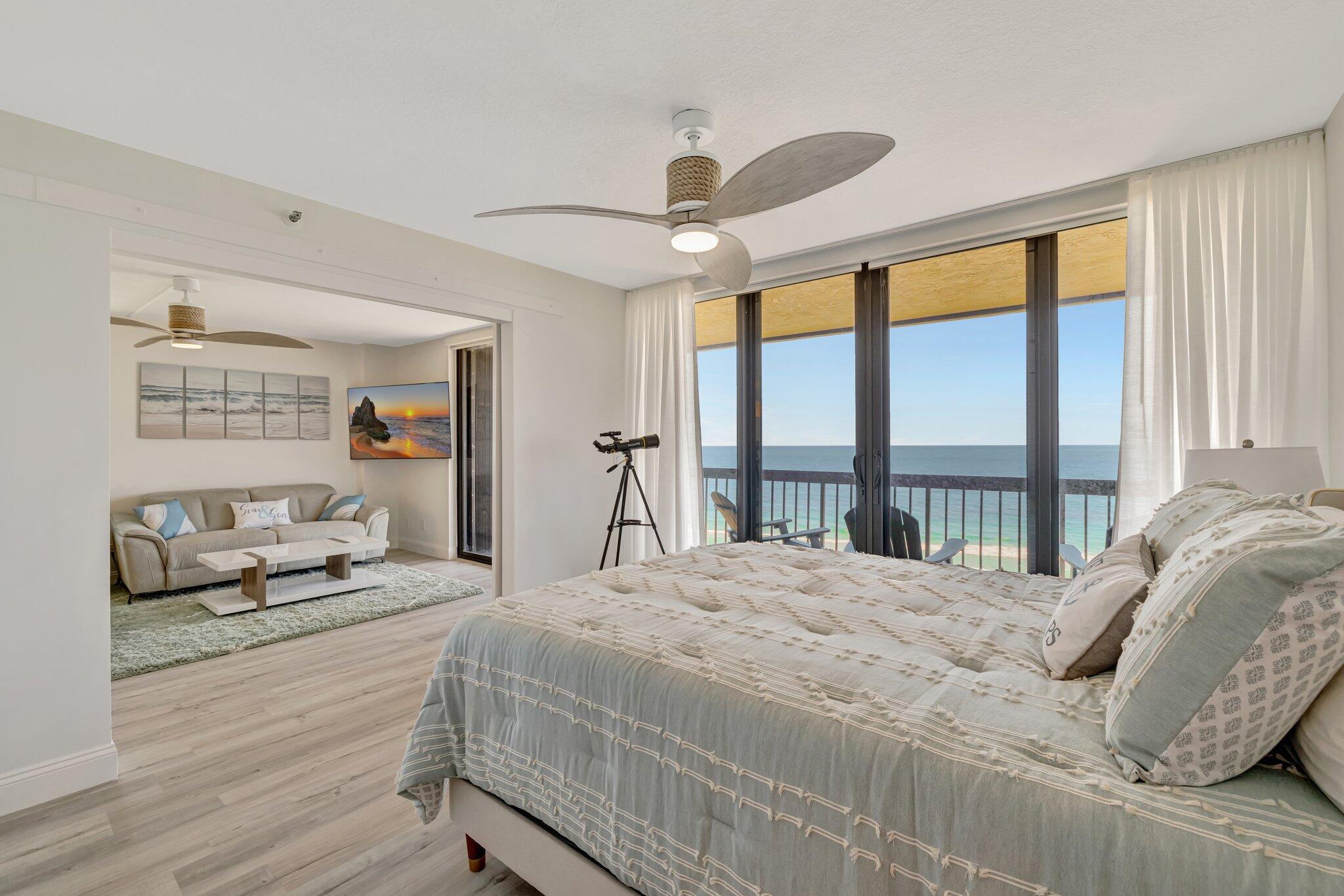 3100 North Hwy A1A, Unit 1102 Hutchinson Island, FL 34949 - Photo 13 of 55 a bedroom with a bed and a large window with the outer view