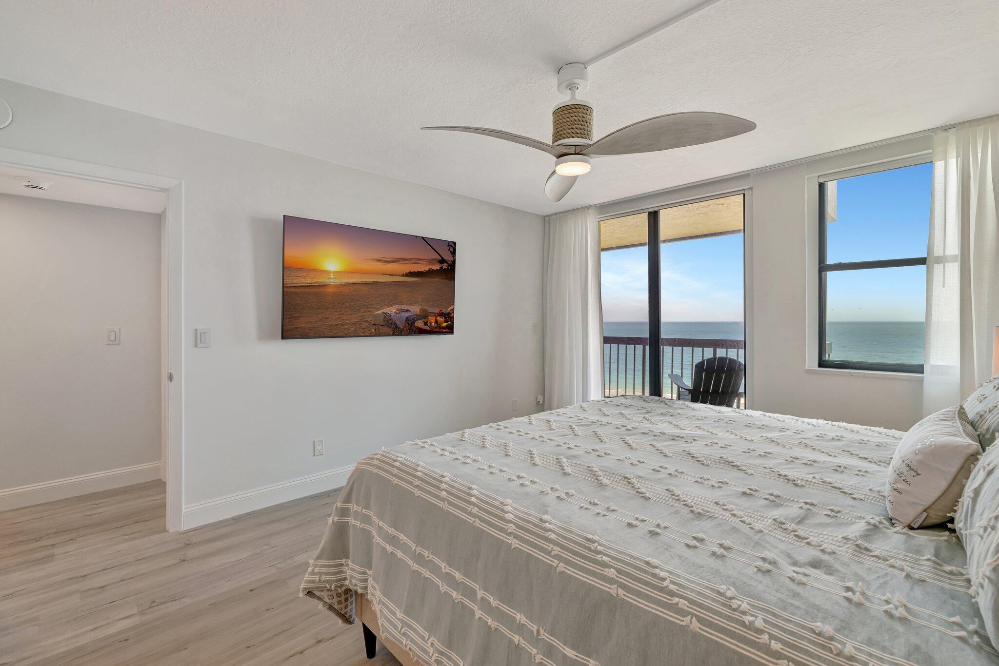 3100 North Hwy A1A, Unit 1102 Hutchinson Island, FL 34949 - Photo 19 of 55 a bedroom with a bed and a window