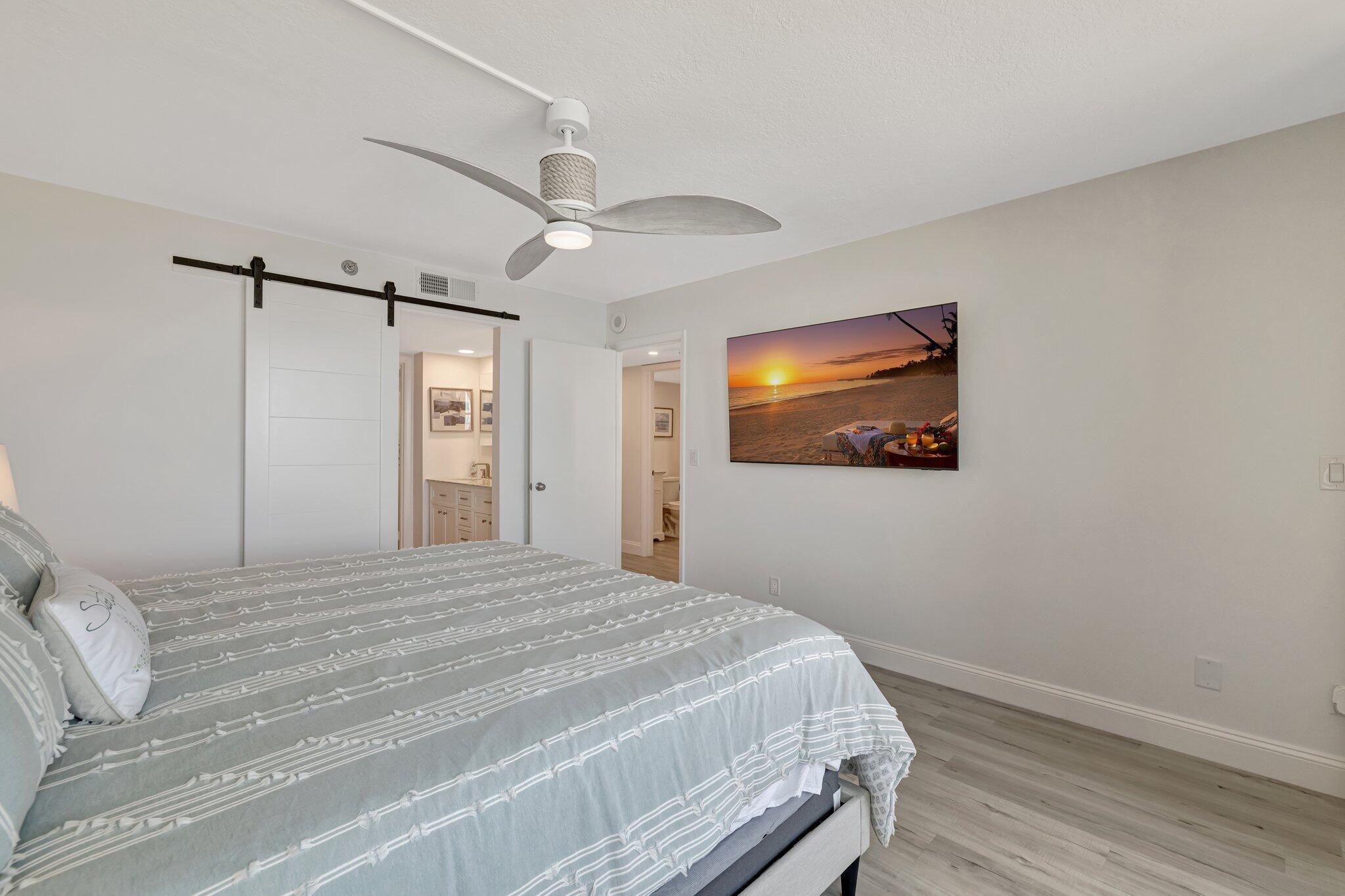 3100 North Hwy A1A, Unit 1102 Hutchinson Island, FL 34949 - Photo 21 of 55 a bedroom with a bed and a painting on the wall