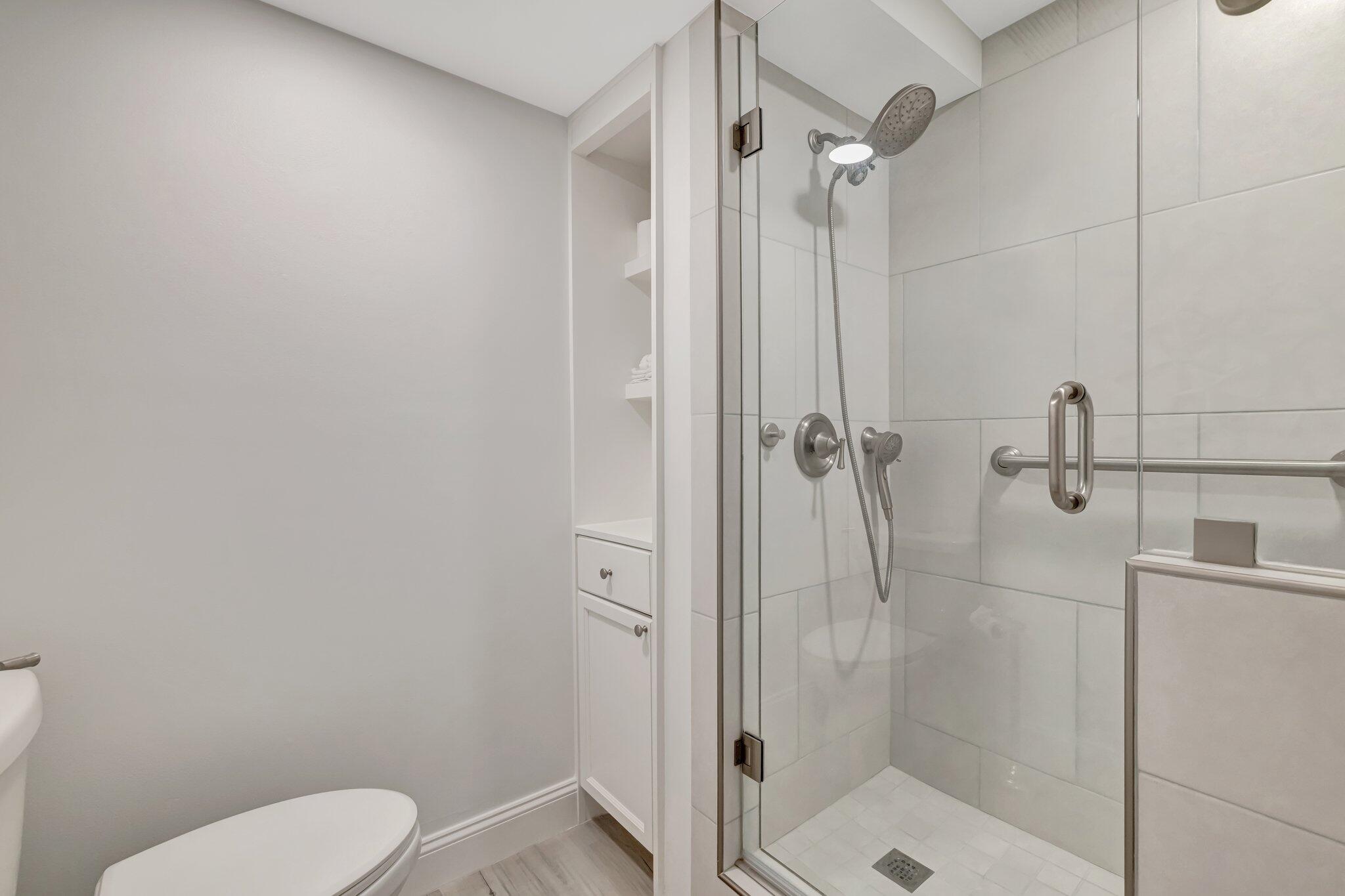 3100 North Hwy A1A, Unit 1102 Hutchinson Island, FL 34949 - Photo 24 of 55 a bathroom with a shower and toilet