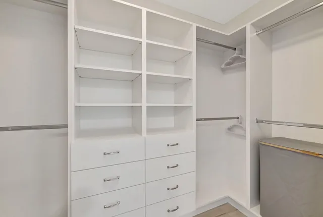 a view of an empty walk in closet