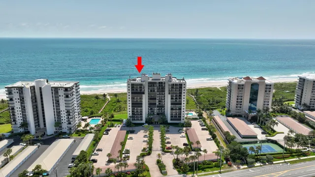 a table tennis table sitting in front of a building