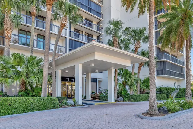 a dining room with furniture and a view of kitchen
