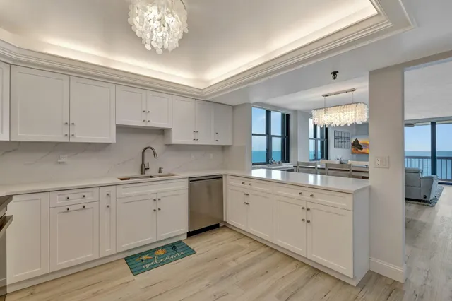 a kitchen with a sink cabinets and window