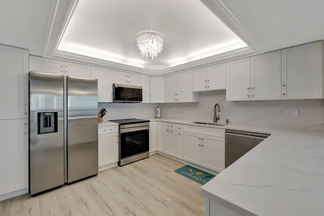 a kitchen with a refrigerator stove and microwave