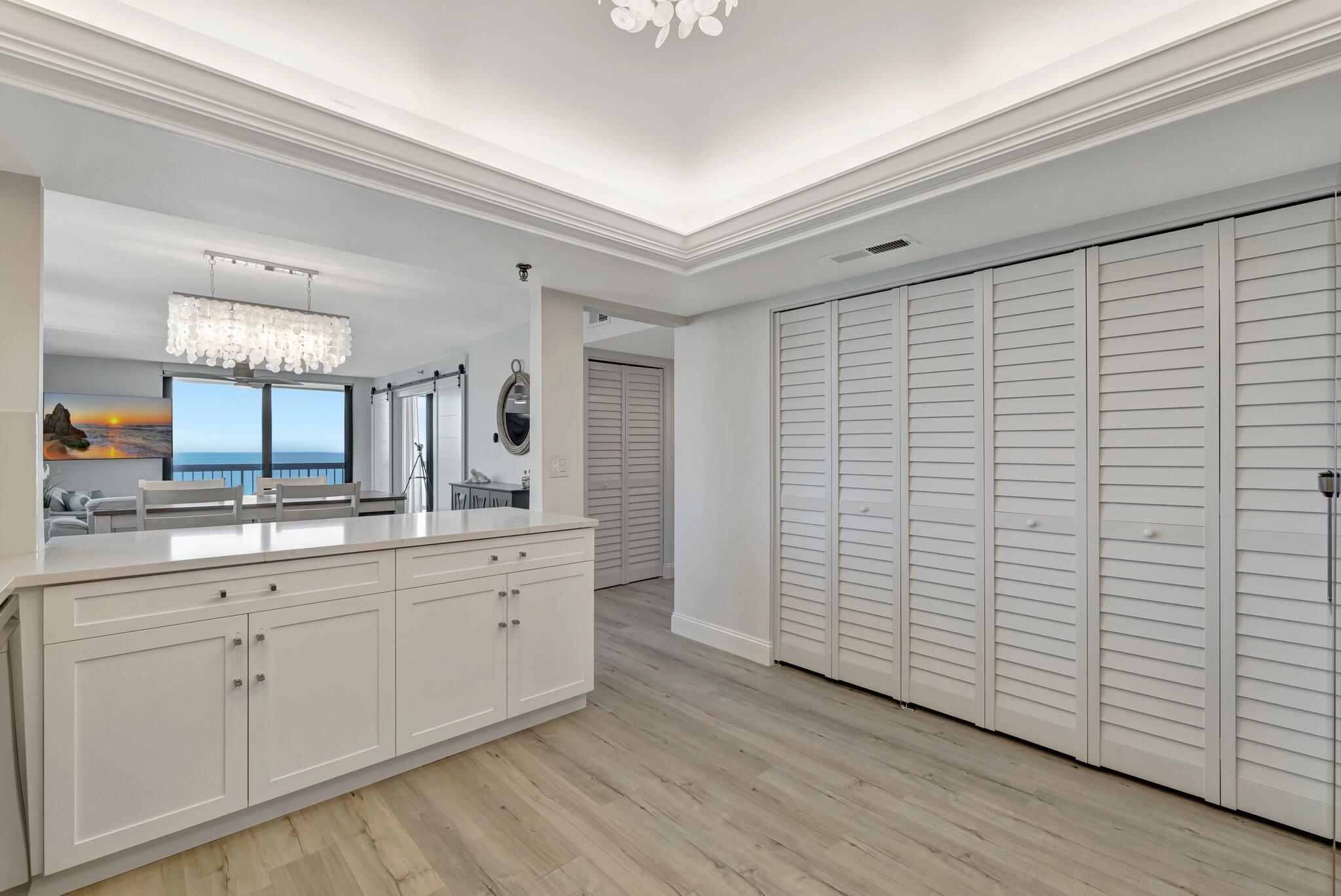 3100 North Hwy A1A, Unit 1102 Hutchinson Island, FL 34949 - Photo 10 of 55 a bathroom with a double vanity sink and a mirror