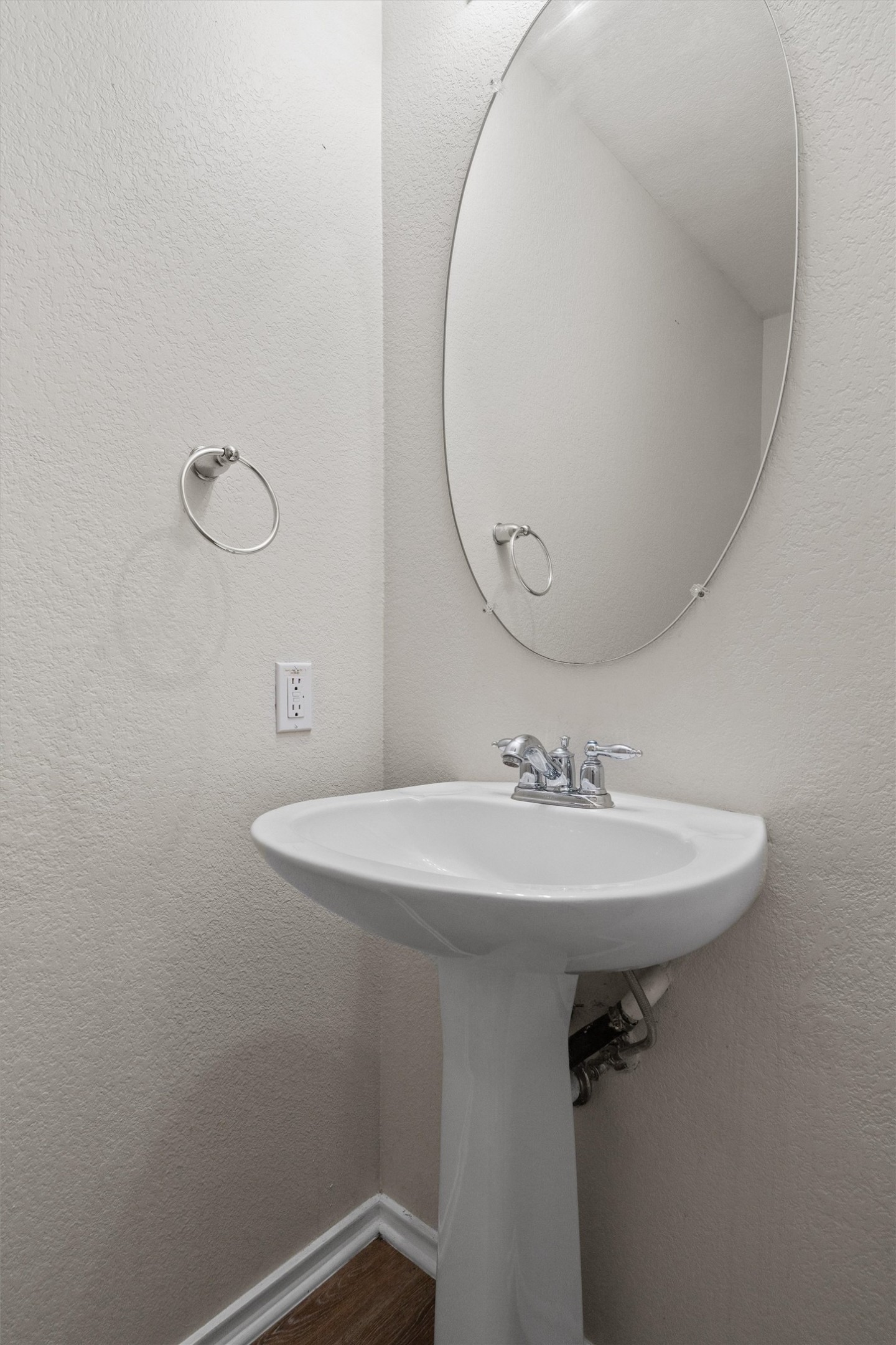 5825 Silver Screen Drive Austin, TX 78747 - Photo 14 of 40 A well-appointed powder room features a pedestal sink and modern fixtures for daily routines.