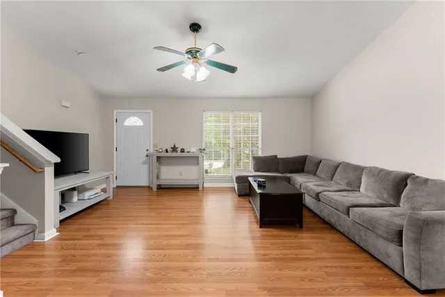 a living room with furniture and a flat screen tv