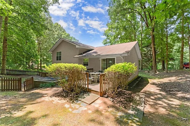 a view of house with outdoor seating area