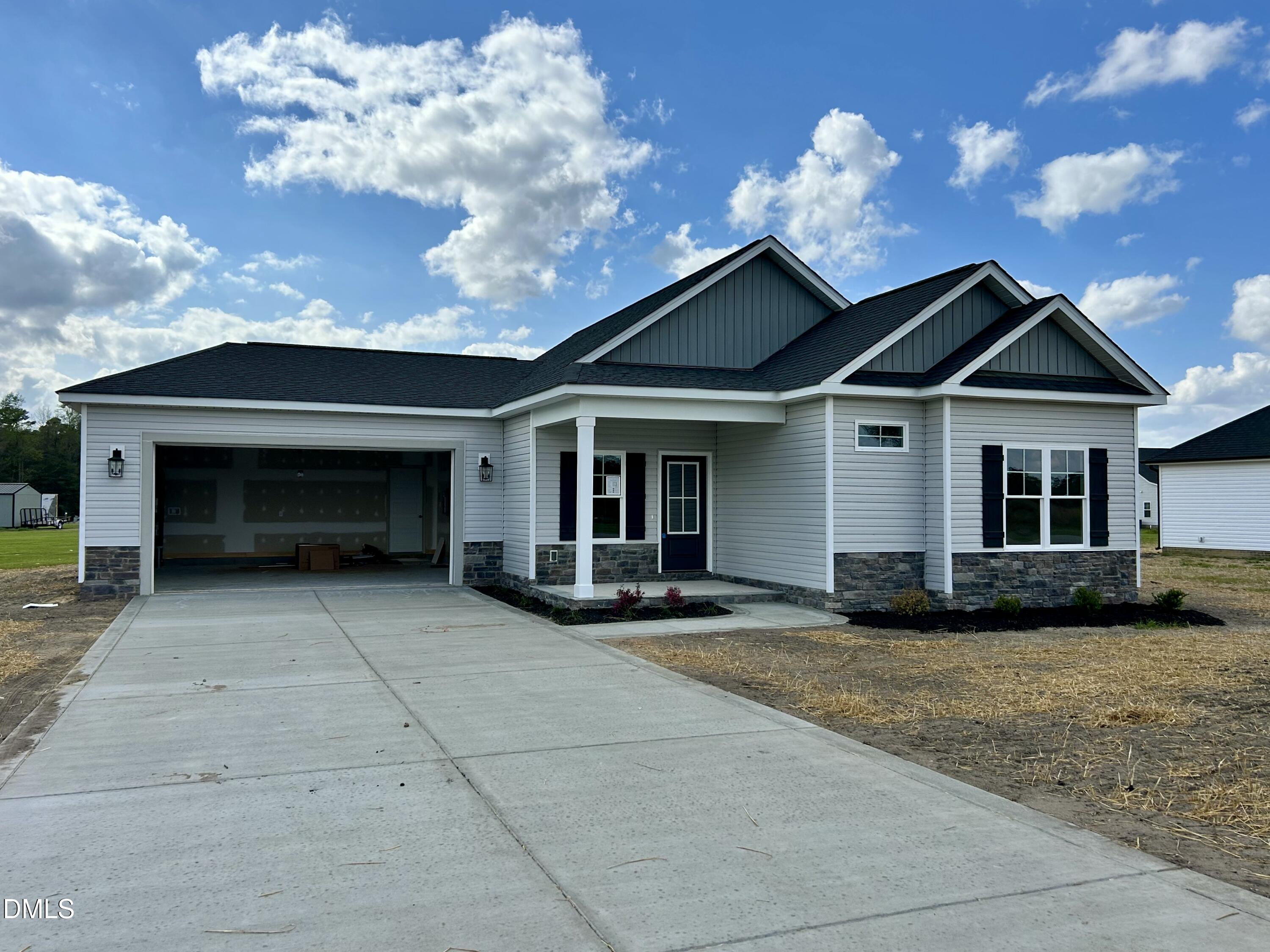 3684 Drew Farmer Road La Grange, NC 28551 - Photo 1 of 18 a front view of a house with a garden and trees