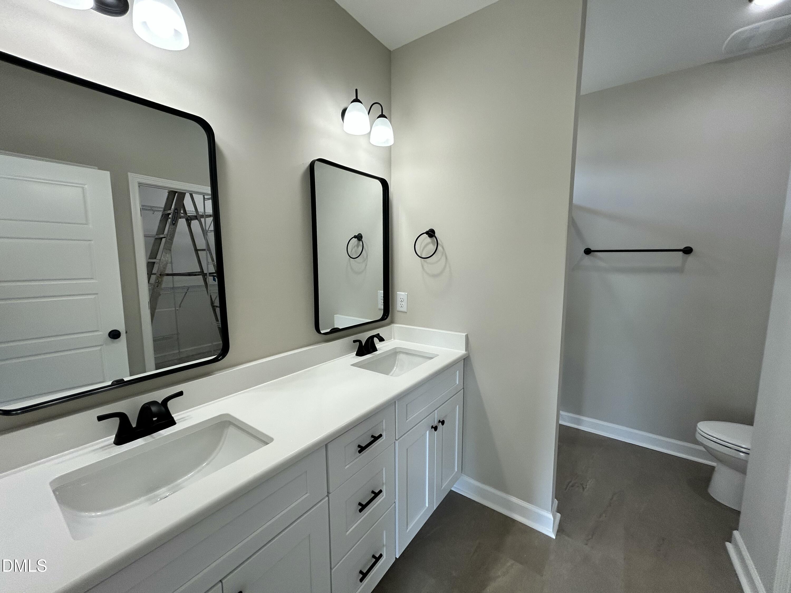 3684 Drew Farmer Road La Grange, NC 28551 - Photo 12 of 18 a bathroom with a double vanity sink toilet and mirror
