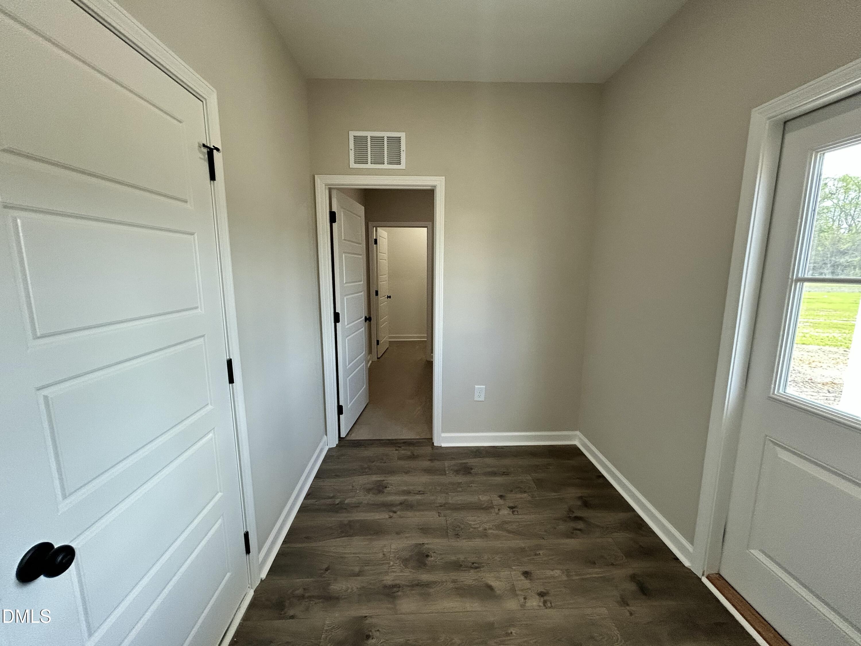 3684 Drew Farmer Road La Grange, NC 28551 - Photo 14 of 18 a view of a hallway with wooden floor and a window