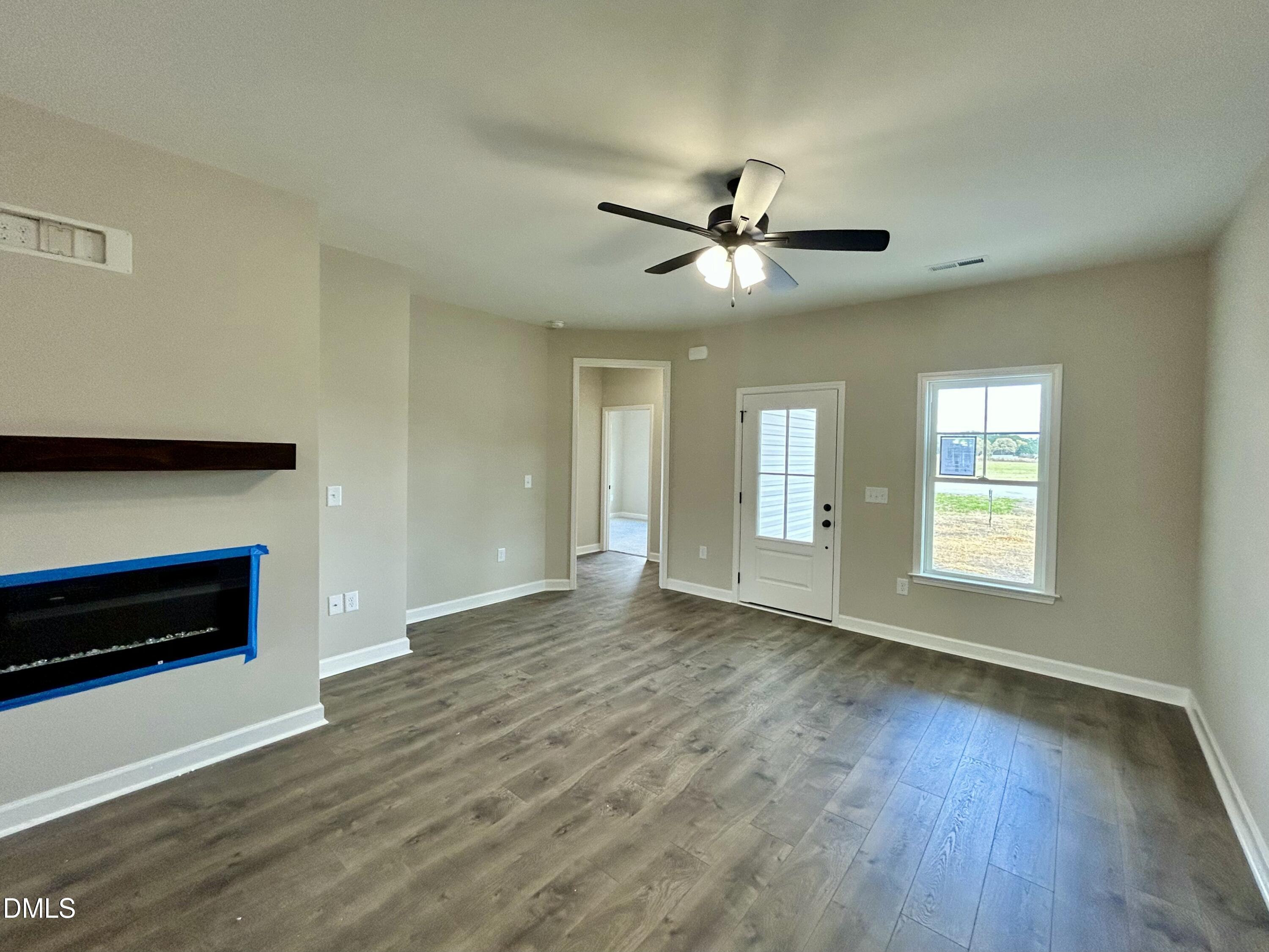 3684 Drew Farmer Road La Grange, NC 28551 - Photo 3 of 18 a view of empty room with wooden floor and fan