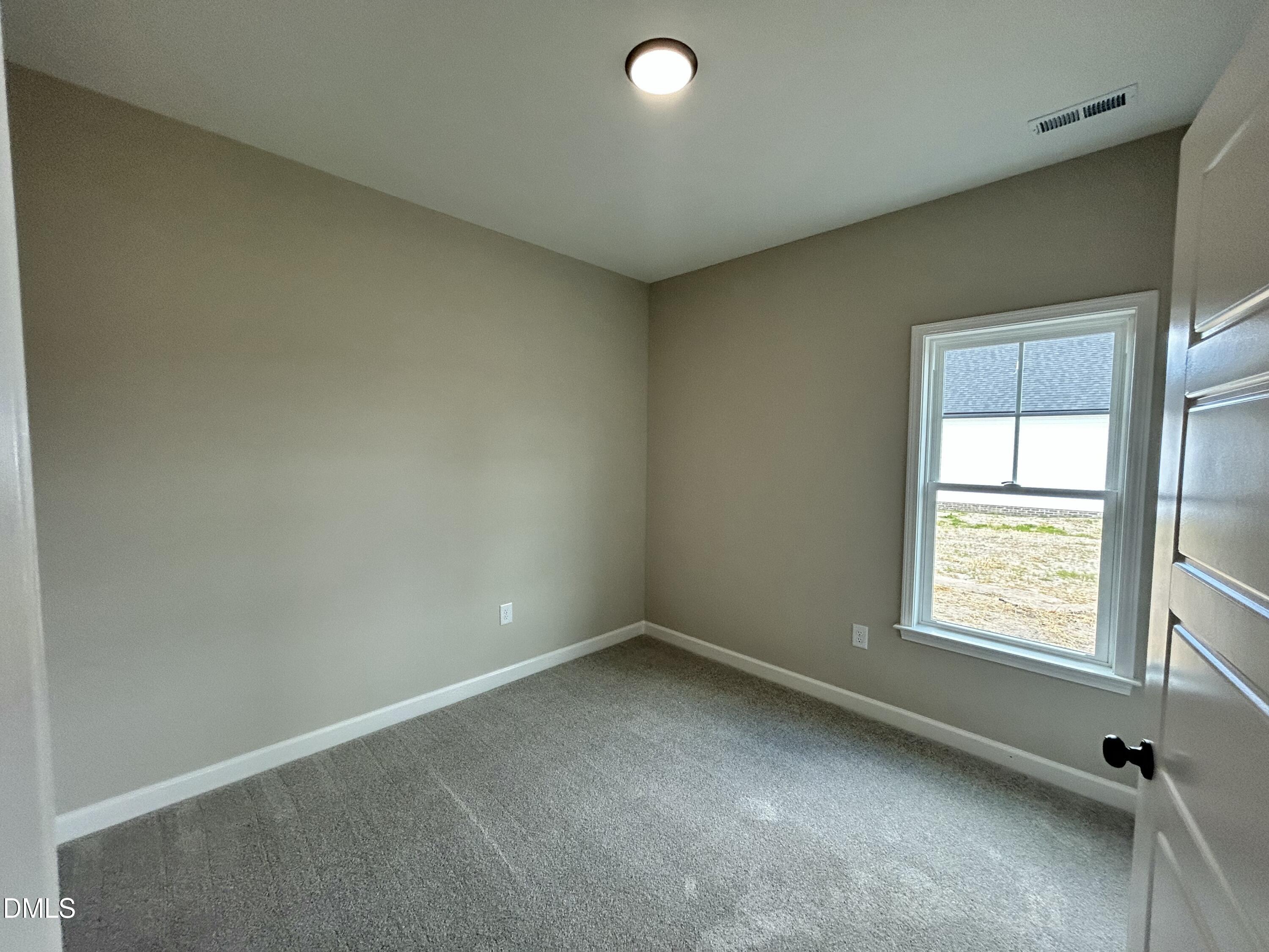 3684 Drew Farmer Road La Grange, NC 28551 - Photo 8 of 18 an empty room with a window