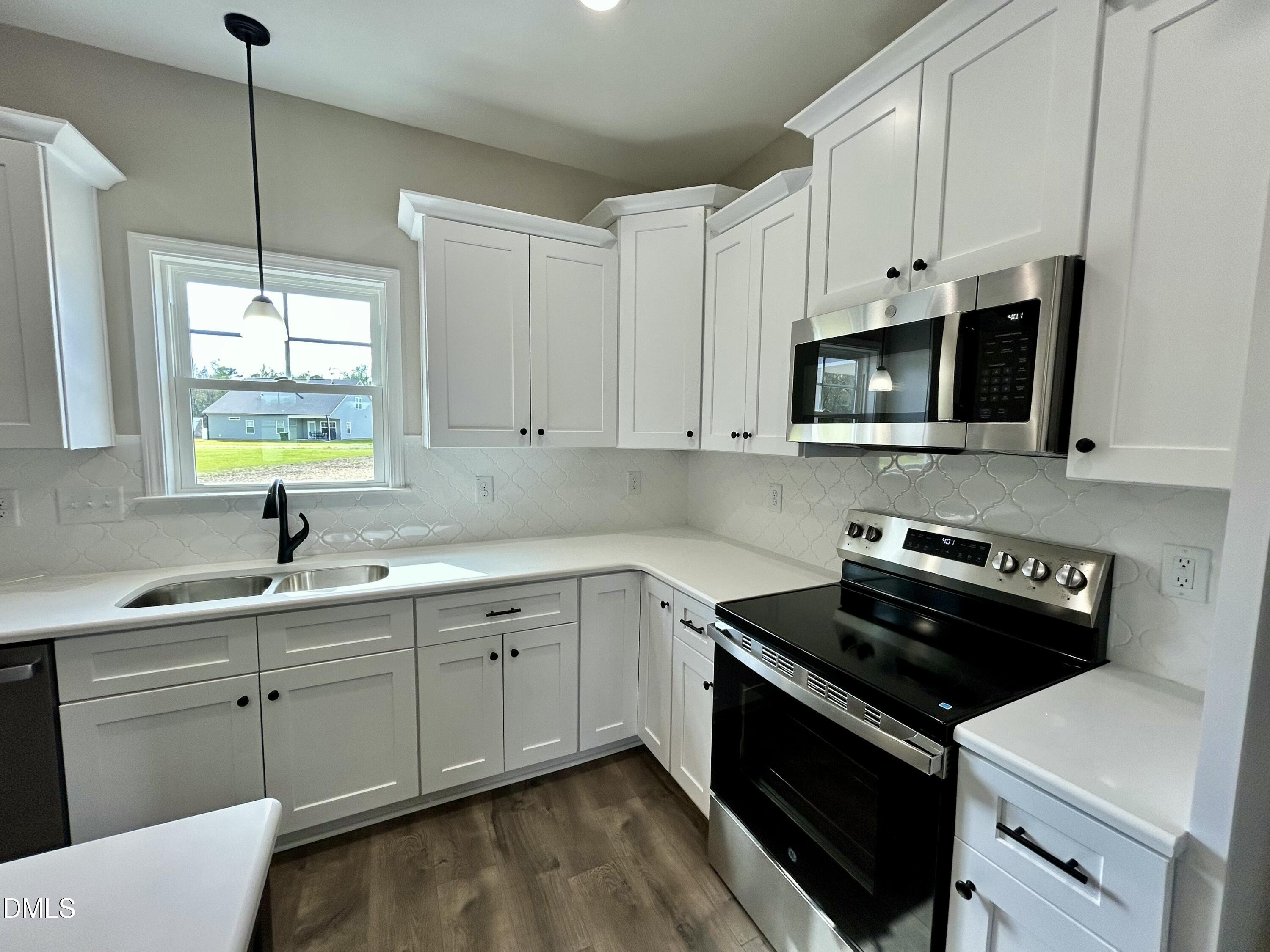 3684 Drew Farmer Road La Grange, NC 28551 - Photo 10 of 18 a kitchen with stainless steel appliances a sink a stove and microwave