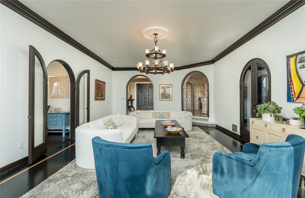 330 Kempton Road Glendale, CA 91202 - Photo 11 of 75 a living room with furniture and a chandelier