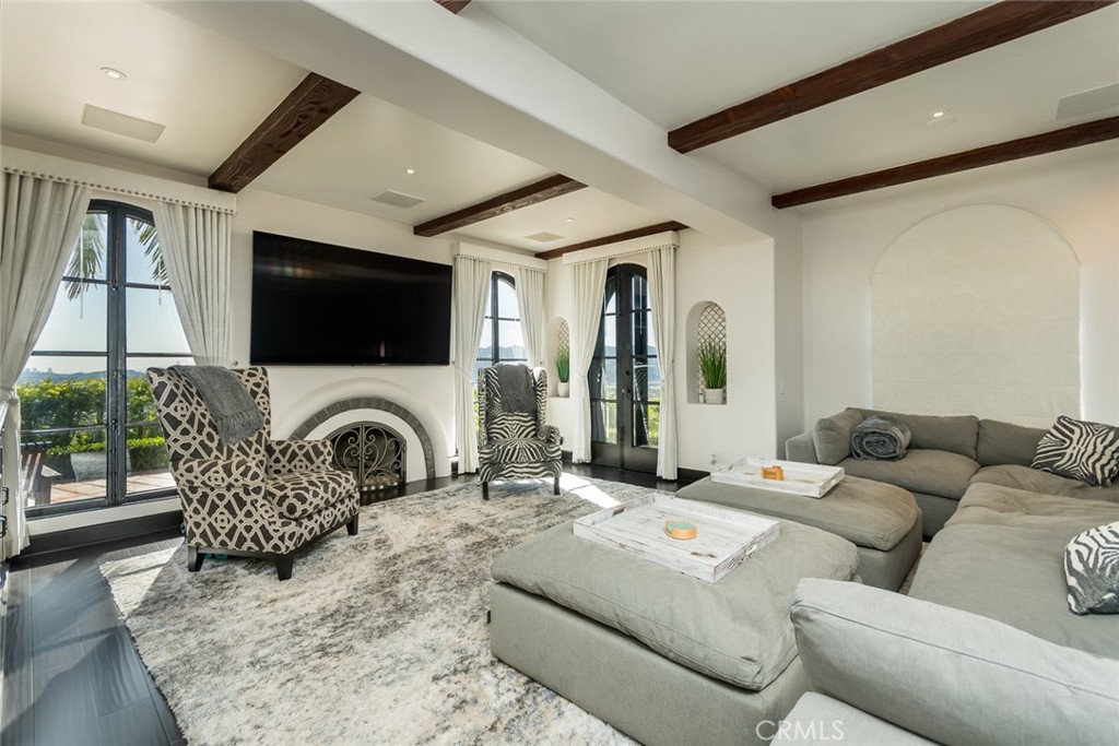 330 Kempton Road Glendale, CA 91202 - Photo 13 of 75 a living room with furniture a flat screen tv and a fireplace