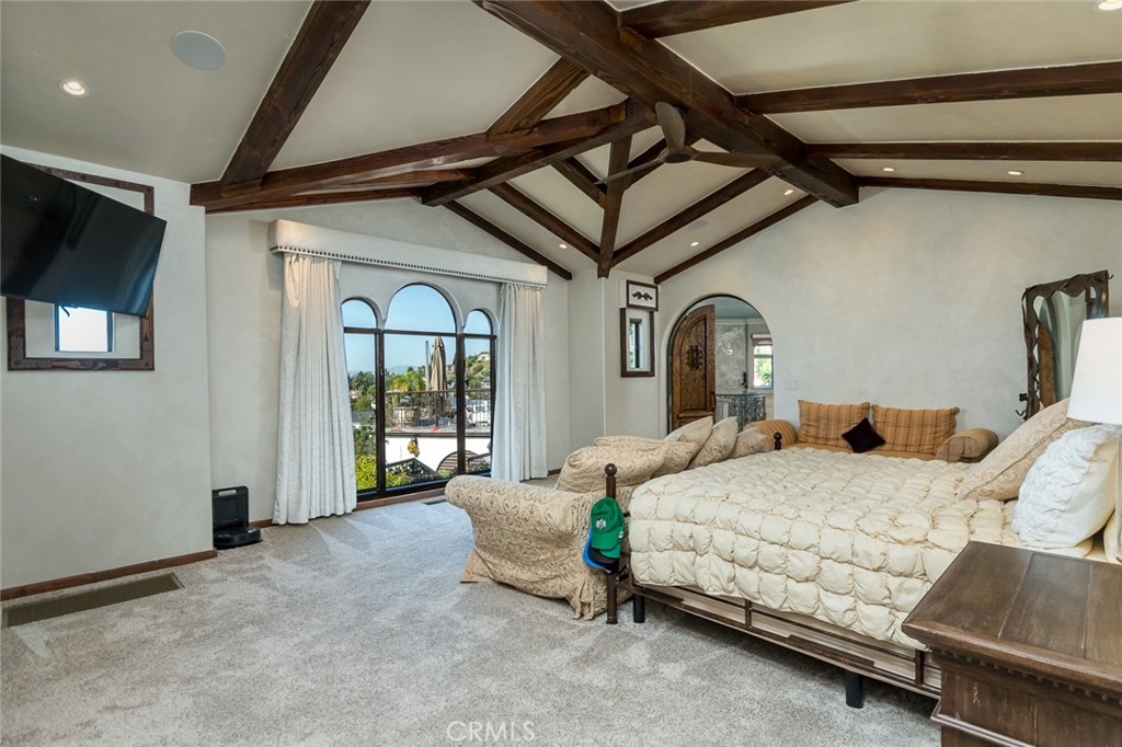330 Kempton Road Glendale, CA 91202 - Photo 21 of 75 a bedroom with a bed mirror and window