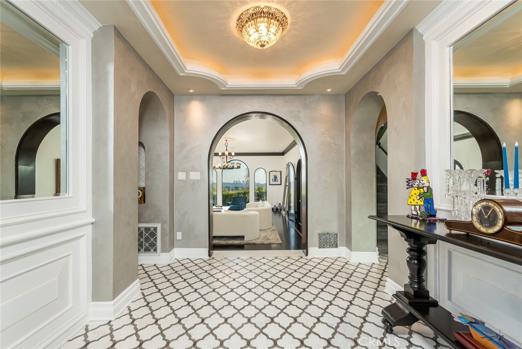 330 Kempton Road Glendale, CA 91202 - Photo 4 of 75 a bedroom with a bed and a chandelier