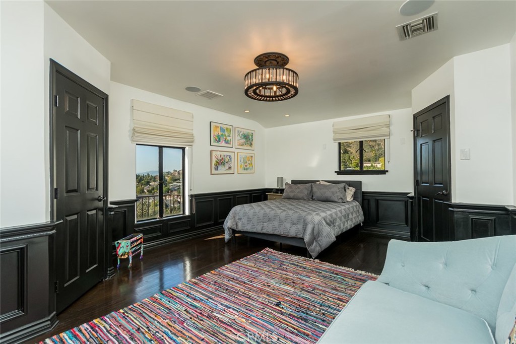 330 Kempton Road Glendale, CA 91202 - Photo 42 of 75 a bedroom with a bed and wooden floor