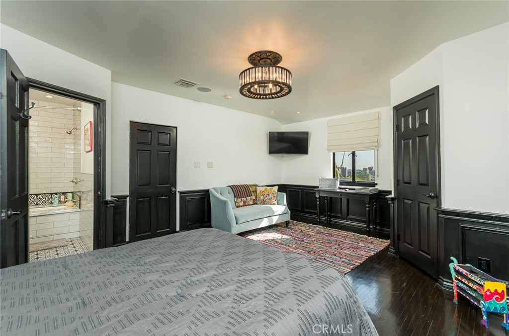 330 Kempton Road Glendale, CA 91202 - Photo 43 of 75 a bedroom with a bed and wooden floor